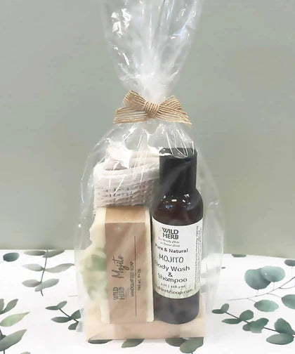 Curated bath gift set with body wash, soap bar and accessories wrapped in cellophane from Simply Serenity